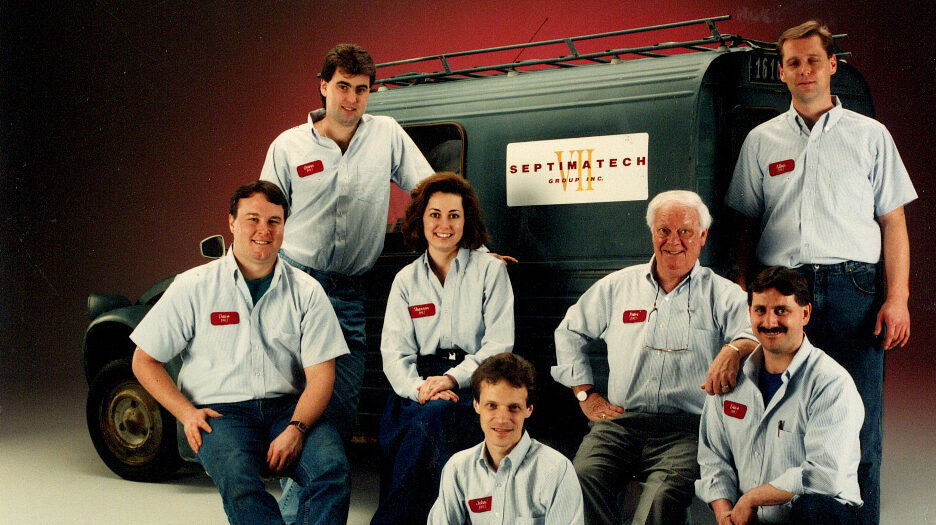 The seven founders of Septimatech posing next to a Septimatech Branded truck